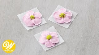 How to Add a Center to Icing Flowers  Wilton [upl. by Tessa]